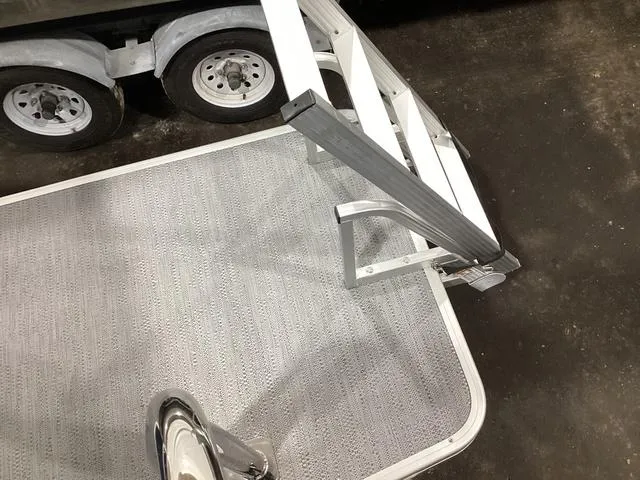 Slide: The Image of 2025 Godfrey Xperience 2286 SBX boat trailer with steps and textured flooring. - 15