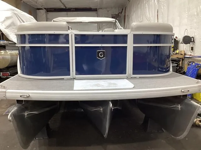 Slide: The Image of 2025 Godfrey Xperience 2286 SBX pontoon boat in a garage setting. - 21