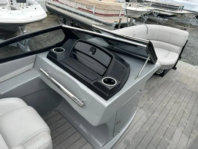 Slide: The Image of 2018 Godfrey Aqua Patio 259ULW Tri-Toon boat interior with seating and console. - 10