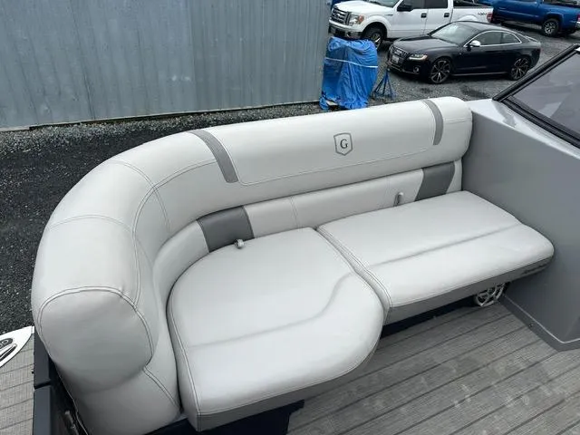 Slide: The Image of 2018 Godfrey Aqua Patio 259ULW Tri-Toon boat with white cushioned seating. - 12