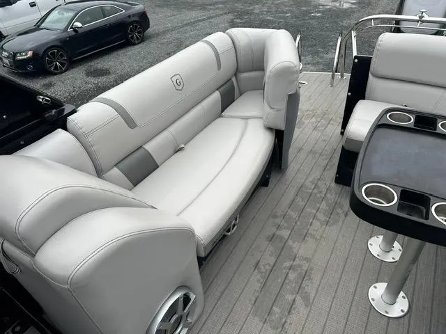 Slide: The Image of 2018 Godfrey Aqua Patio 259ULW Tri-Toon with luxurious seating and cup holders. - 15