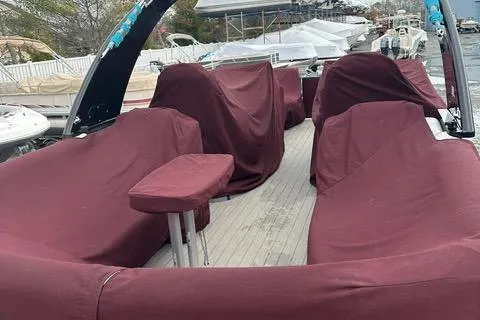 Slide: The Image of 2018 Godfrey Aqua Patio 259ULW Tri-Toon with maroon covers, docked at marina. - 3
