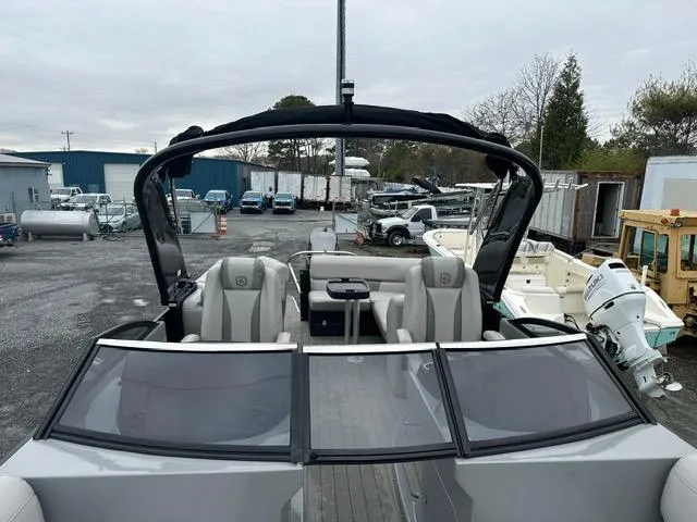 Slide: The Image of 2018 Godfrey Aqua Patio 259ULW Tri-Toon boat in a storage yard. - 4