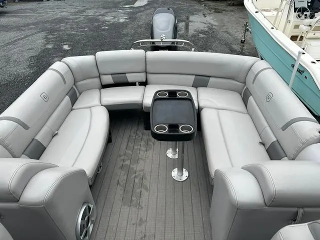 Slide: The Image of 2018 Godfrey Aqua Patio 259ULW Tri-Toon with spacious seating and table. - 9