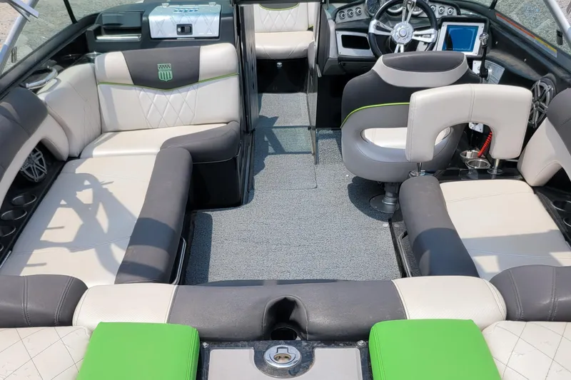 Slide: The Image of 2012 MasterCraft X25 boat interior with modern seating and steering console. - 16