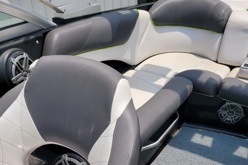 Slide: The Image of 2012 MasterCraft X25 boat interior with black and white seating. - 19