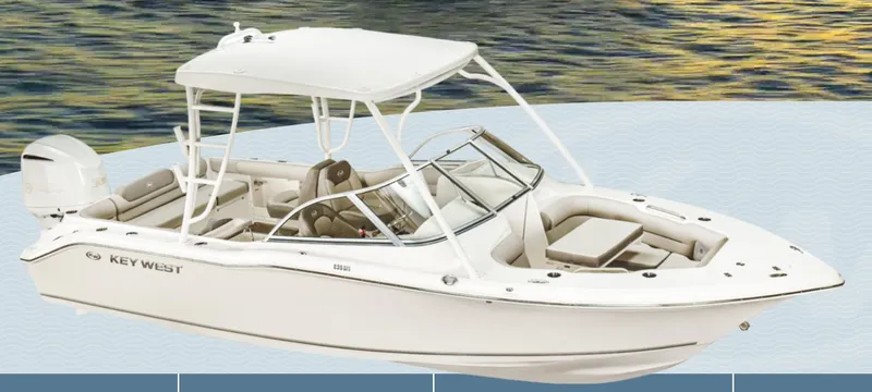 Slide: The Image of 2025 Key West 239DFS boat on water, featuring sleek design and spacious seating. - 1