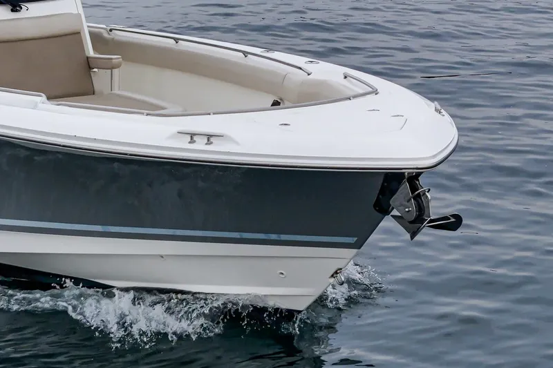 Slide: The Image of 2019 Boston Whaler 330 Outrage boat cruising on water. - 10