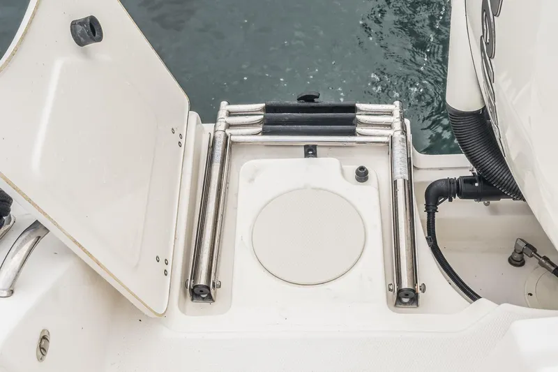 Slide: The Image of 2019 Boston Whaler 330 Outrage swim platform with ladder and open hatch. - 30