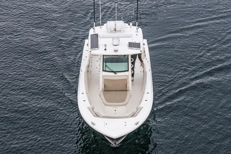 Slide: The Image of 2019 Boston Whaler 330 Outrage boat on open water, aerial view. - 39