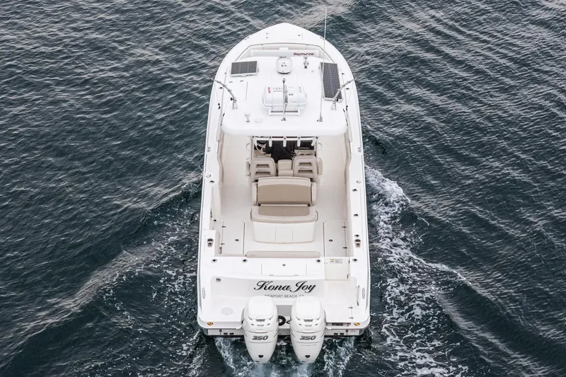 Slide: The Image of 2019 Boston Whaler 330 Outrage boat cruising on open water, aerial view. - 41
