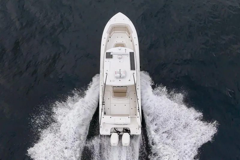 Slide: The Image of Aerial view of 2019 Boston Whaler 330 Outrage cruising on open water. - 7