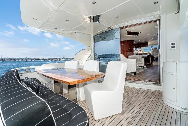 Slide: The Image of Luxurious 2004 Marquis yacht with elegant outdoor seating and ocean view. - 13
