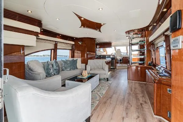 Slide: The Image of Luxurious 2004 Marquis yacht interior with elegant wood finishes and plush seating. - 18