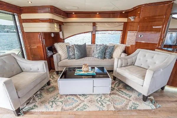 Slide: The Image of Luxurious 2004 Marquis yacht interior with elegant seating and stylish decor. - 19
