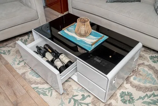 Slide: The Image of Modern coffee table with built-in wine storage and decorative items on top. - 20