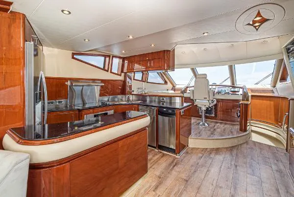 Slide: The Image of Luxurious 2004 Marquis yacht interior with modern kitchen and helm station. - 24