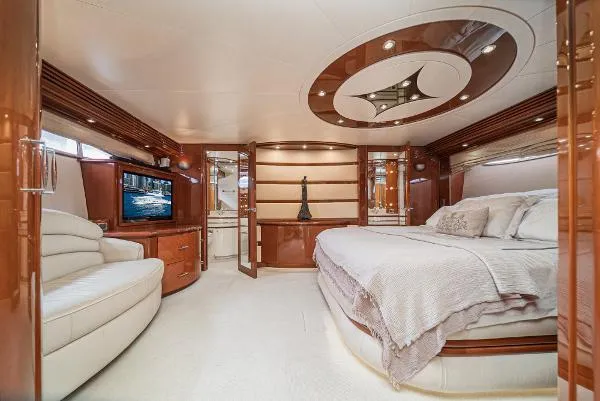 Slide: The Image of Luxurious 2004 Marquis yacht interior with elegant bedroom and modern amenities. - 28
