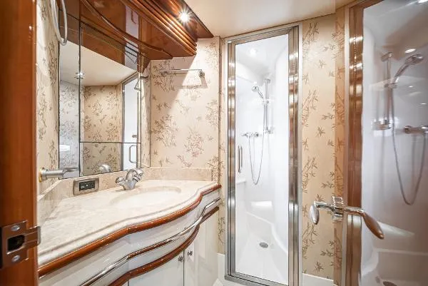 Slide: The Image of Luxurious 2004 Marquis yacht bathroom with elegant wood accents and modern shower. - 37