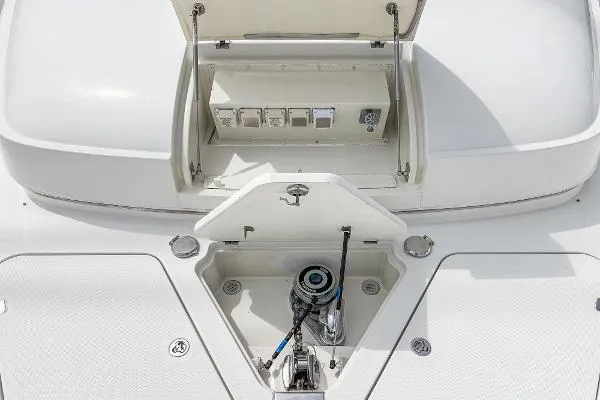 Slide: The Image of Open hatch on 2004 Marquis boat deck showing electrical panel and winch. - 42