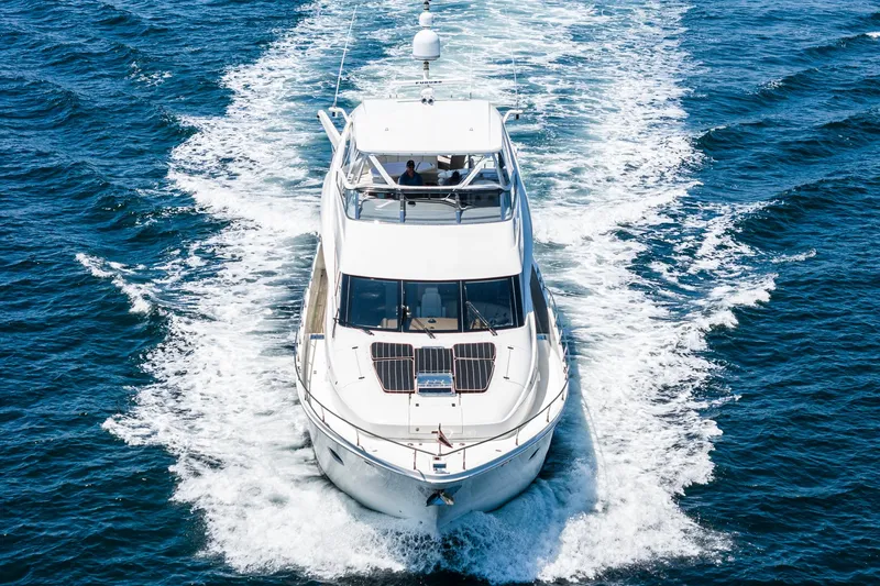 Slide: The Image of Luxurious 2004 Marquis yacht cruising on open blue waters. - 45