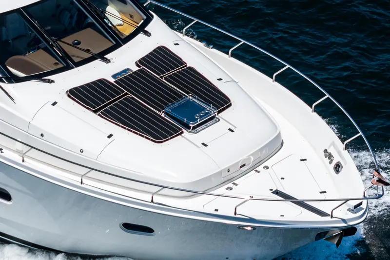Slide: The Image of 2004 Marquis yacht with solar panels on deck, cruising on blue water. - 48