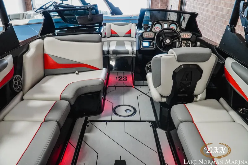 Slide: The Image of 2020 Axis T23 boat interior with modern seating and dashboard at Lake Norman Marina. - 10