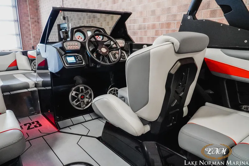 Slide: The Image of 2020 Axis T23 boat interior with modern dashboard and comfortable seating. - 11