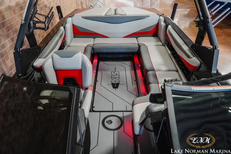 Slide: The Image of 2020 Axis T23 boat interior with red and gray seating at Lake Norman Marina. - 14