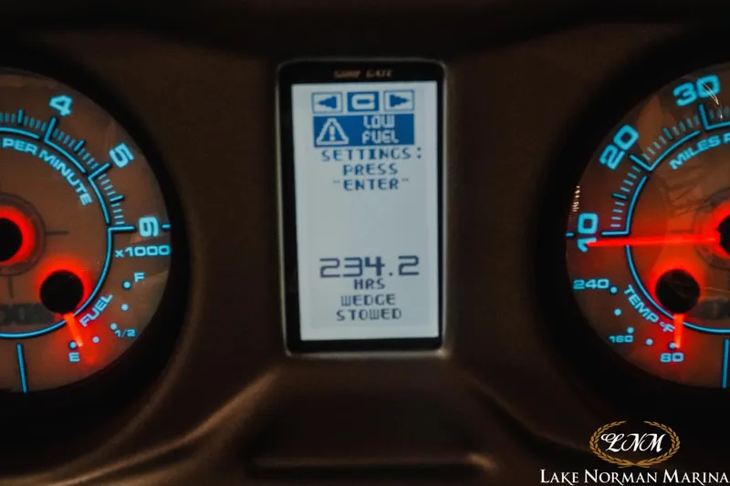 Slide: The Image of Axis T23 2020 dashboard display showing 234.2 hours and low fuel warning. - 18