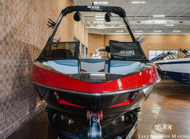 Slide: The Image of 2020 Axis T23 boat in showroom, red and black design, Lake Norman Marina. - 4