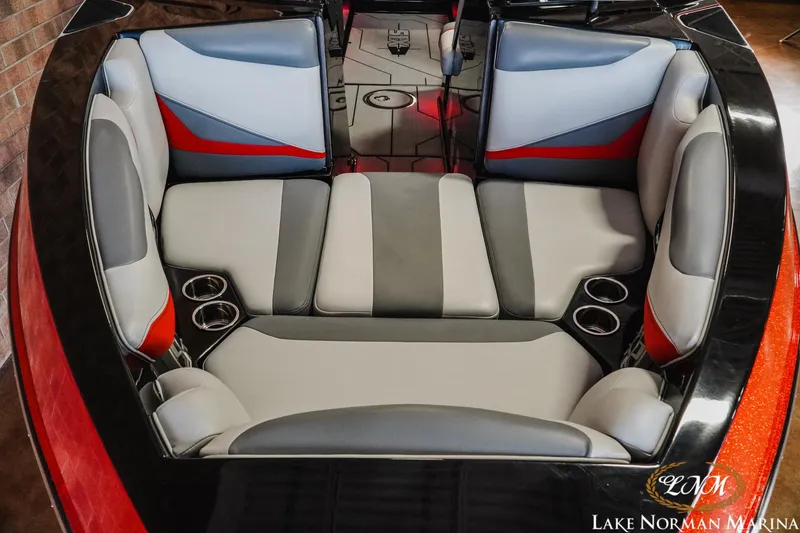 Slide: The Image of 2020 Axis T23 boat interior with gray and red seating, cup holders, Lake Norman Marina. - 5