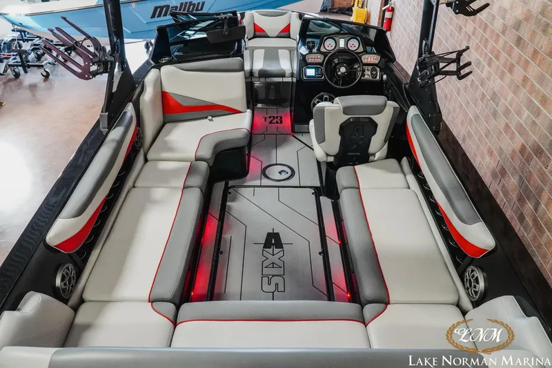 Slide: The Image of 2020 Axis T23 boat interior with sleek seating and modern dashboard at Lake Norman Marina. - 9