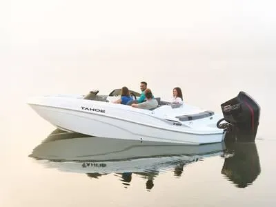 The Image of 2025 Tahoe T21 boat on calm water with passengers enjoying a ride. - 1