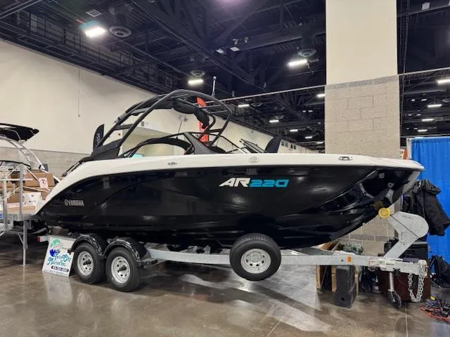 The Image of 2025 Yamaha Boats AR220 displayed indoors on a trailer. - 0