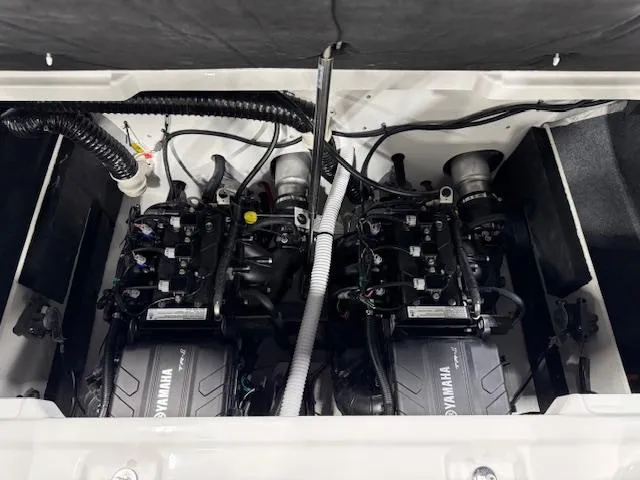 Slide: The Image of 2025 Yamaha Boats AR220 engine compartment with dual engines and wiring. - 12
