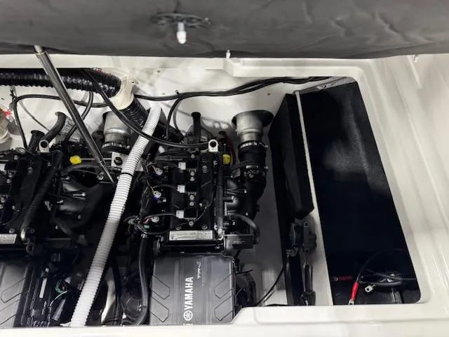 Slide: The Image of 2025 Yamaha Boats AR220 engine compartment with dual engines and wiring. - 14