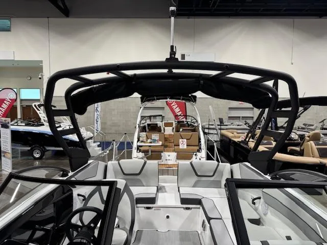 Slide: The Image of 2025 Yamaha Boats AR220 interior at a boat show, showcasing sleek design and modern features. - 4