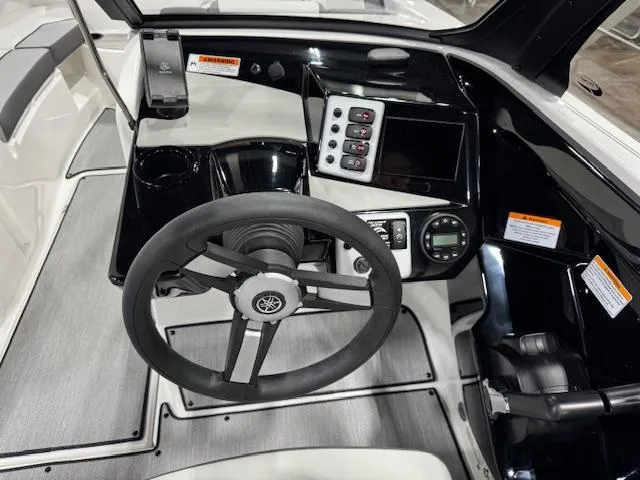 Slide: The Image of 2025 Yamaha Boats AR220 dashboard with steering wheel and control panel. - 6