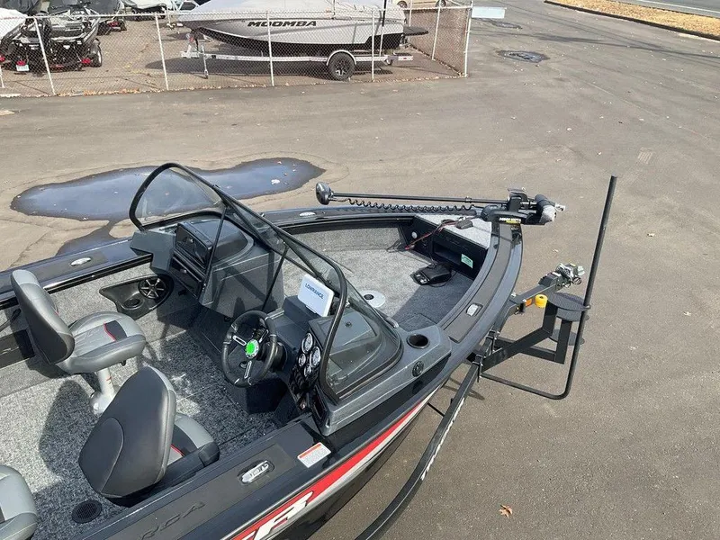 Slide: The Image of 2025 Tracker Targa™ V-18 WT boat interior with steering wheel and seating. - 11