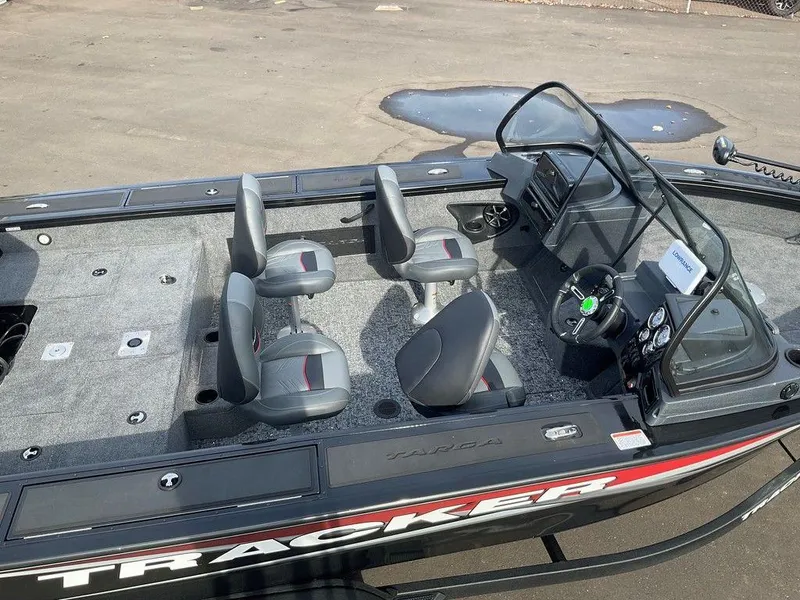 Slide: The Image of 2025 Tracker Targa™ V-18 WT boat interior with seating and steering console. - 12