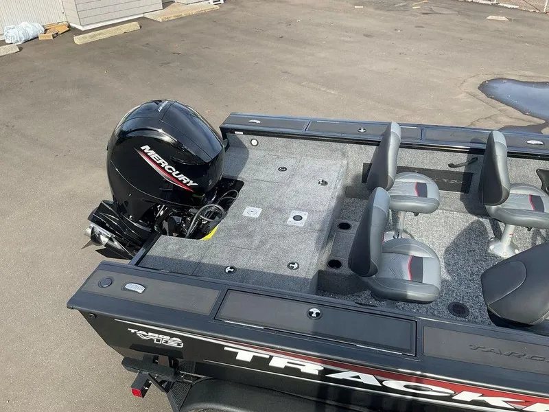 Slide: The Image of 2025 Tracker Targa™ V-18 WT boat with Mercury engine, featuring spacious seating and deck. - 13