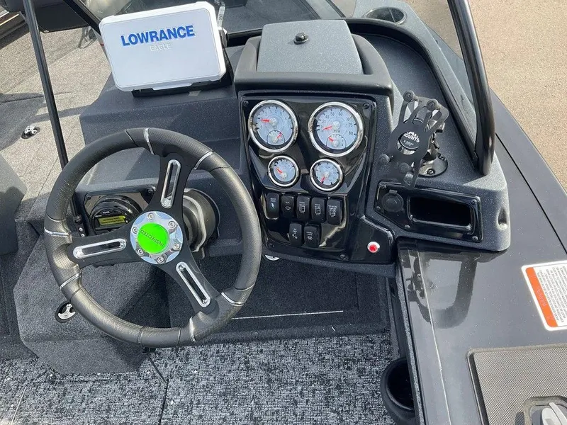 Slide: The Image of 2025 Tracker Targa™ V-18 WT dashboard with steering wheel and gauges. - 17