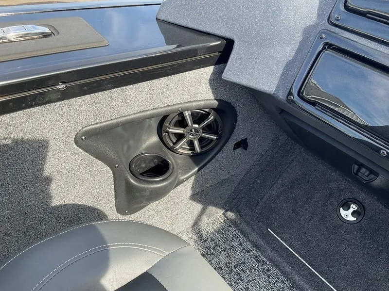 Slide: The Image of 2025 Tracker Targa™ V-18 WT boat interior with speaker and cup holder. - 20