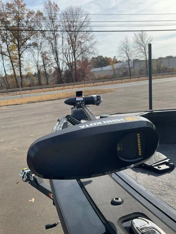 Slide: The Image of 2025 Tracker Targa™ V-18 WT boat with Minn Kota trolling motor in a parking lot. - 21