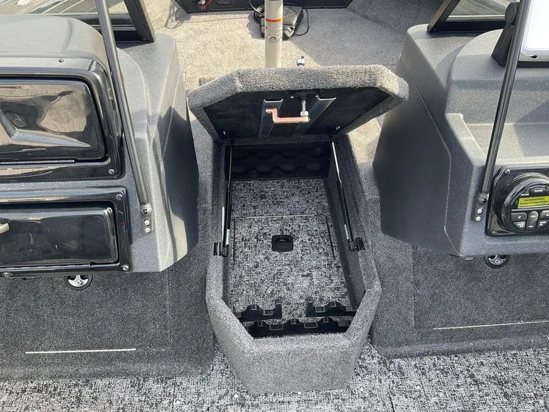 Slide: The Image of 2025 Tracker Targa™ V-18 WT boat interior with open storage compartment. - 22