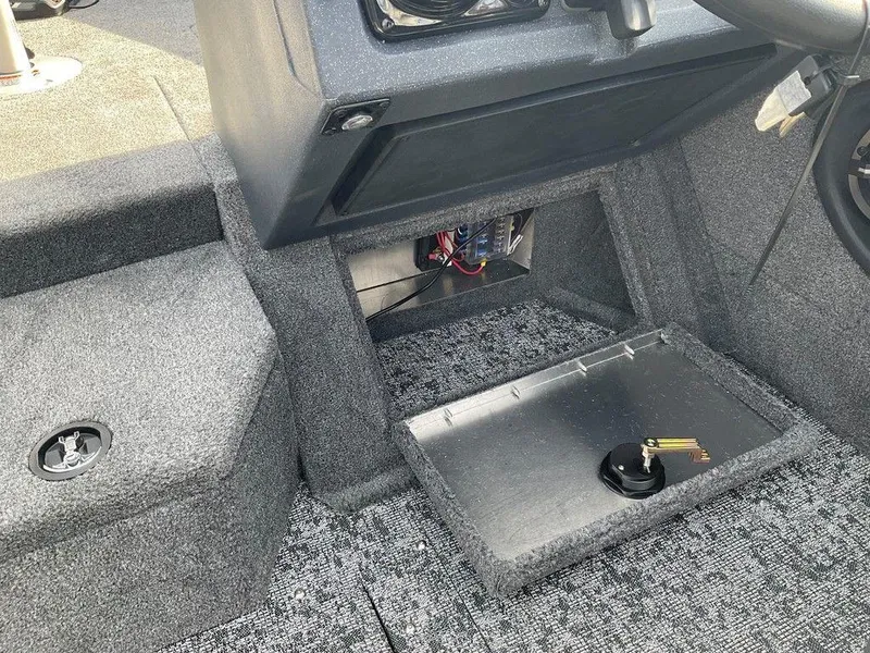 Slide: The Image of 2025 Tracker Targa™ V-18 WT boat interior with open storage compartment. - 28