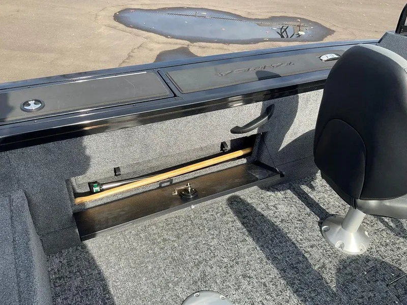 Slide: The Image of 2025 Tracker Targa™ V-18 WT boat interior with storage compartment and seating. - 29