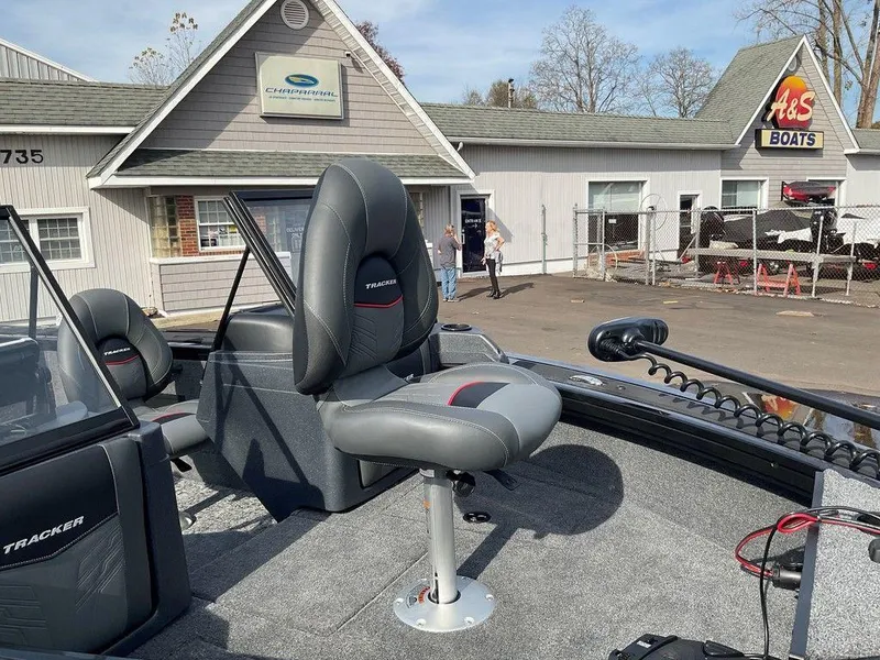 Slide: The Image of 2025 Tracker Targa™ V-18 WT boat with seating, parked at A&S Boats dealership. - 30