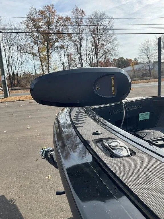 Slide: The Image of 2025 Tracker Targa™ V-18 WT boat with trolling motor, parked outdoors. - 31